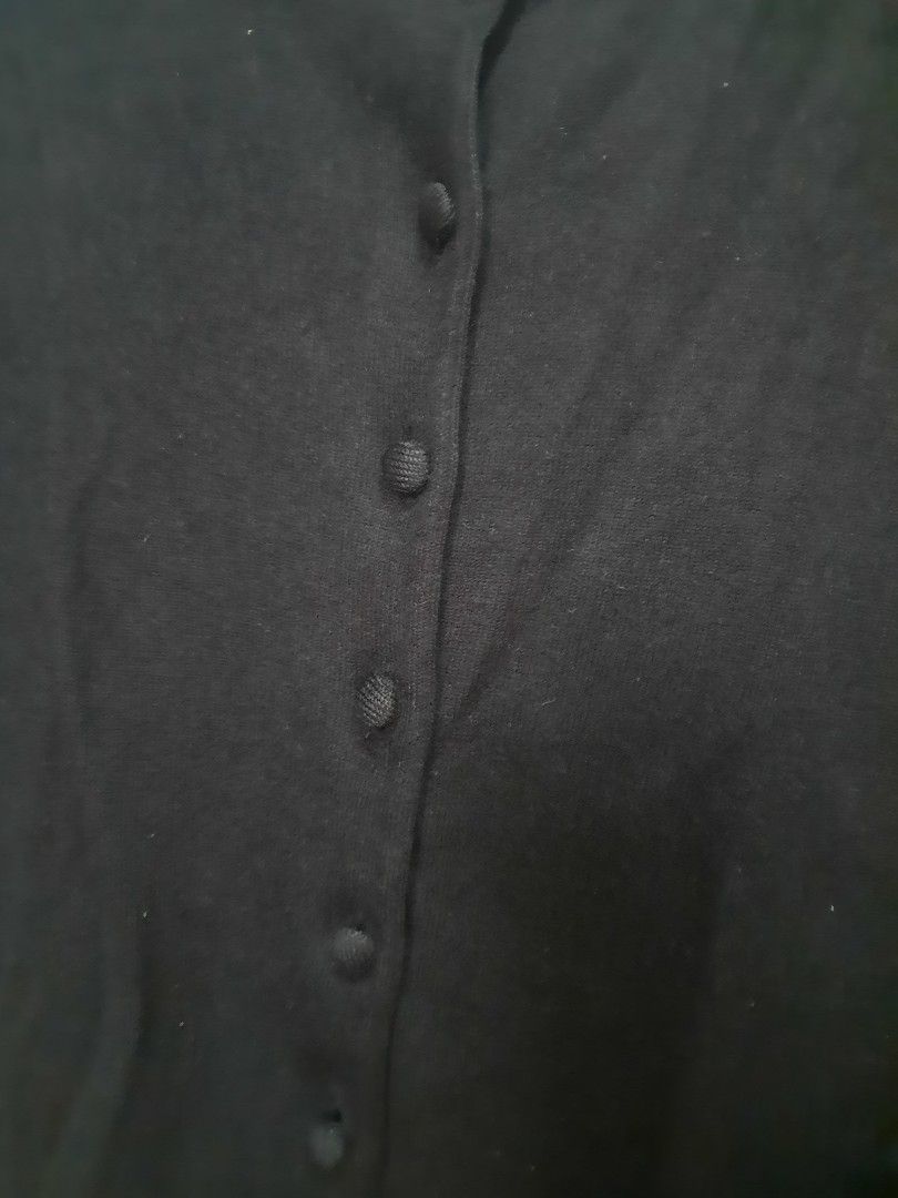 Black Crewneck Button Down Knit Cardigan (Category: Coats, Jackets and Outerwear) located in Quezon City. Submitted by dannikkishoppe2 (Listing ID 1470478571, Image 3). Description: Black Crewneck Button Down Knit Cardigan‼️₱300‼️ • Style & Fit: Timeless slim-fit crewneck cardigan with long sleeves and a neat button-front placket. • Material & Texture: Soft, lightweight fine-gauge knit fabric providing comfortable stretch and breathable warmth. •