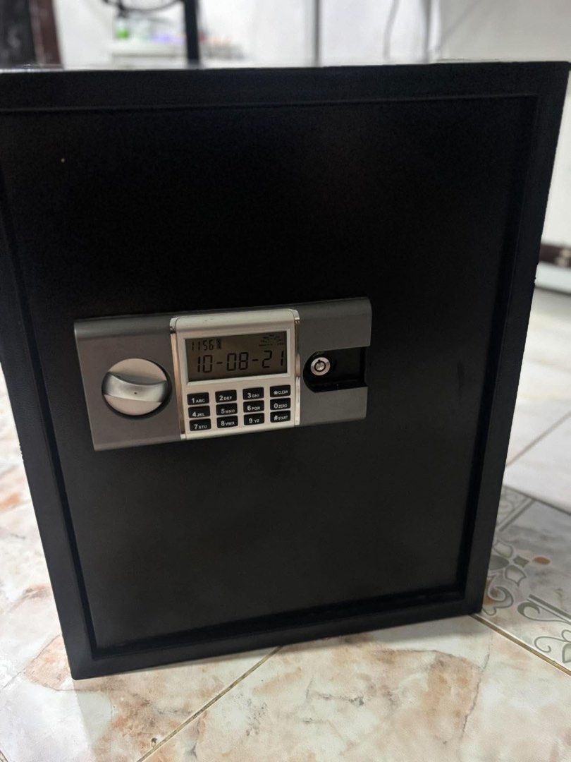 Black Digital Safe Box with Keypad and LCD Screen (Category: Safe) located in Bulacan. Submitted by czfullcart (Listing ID 1470366056, Image 1). Description: 🔒ELECTRONIC DIGITAL SAFE VAULT FOR SALE - Good Condition For sale: Black Electronic Safe with Digital Keypad + Manual Key Override Details: Color: Matte Black Lock Type: Digital Code + Emergency Key (double security) Features: LCD Display (Date/Time), Auto-lock, Low battery warning Keypad: 