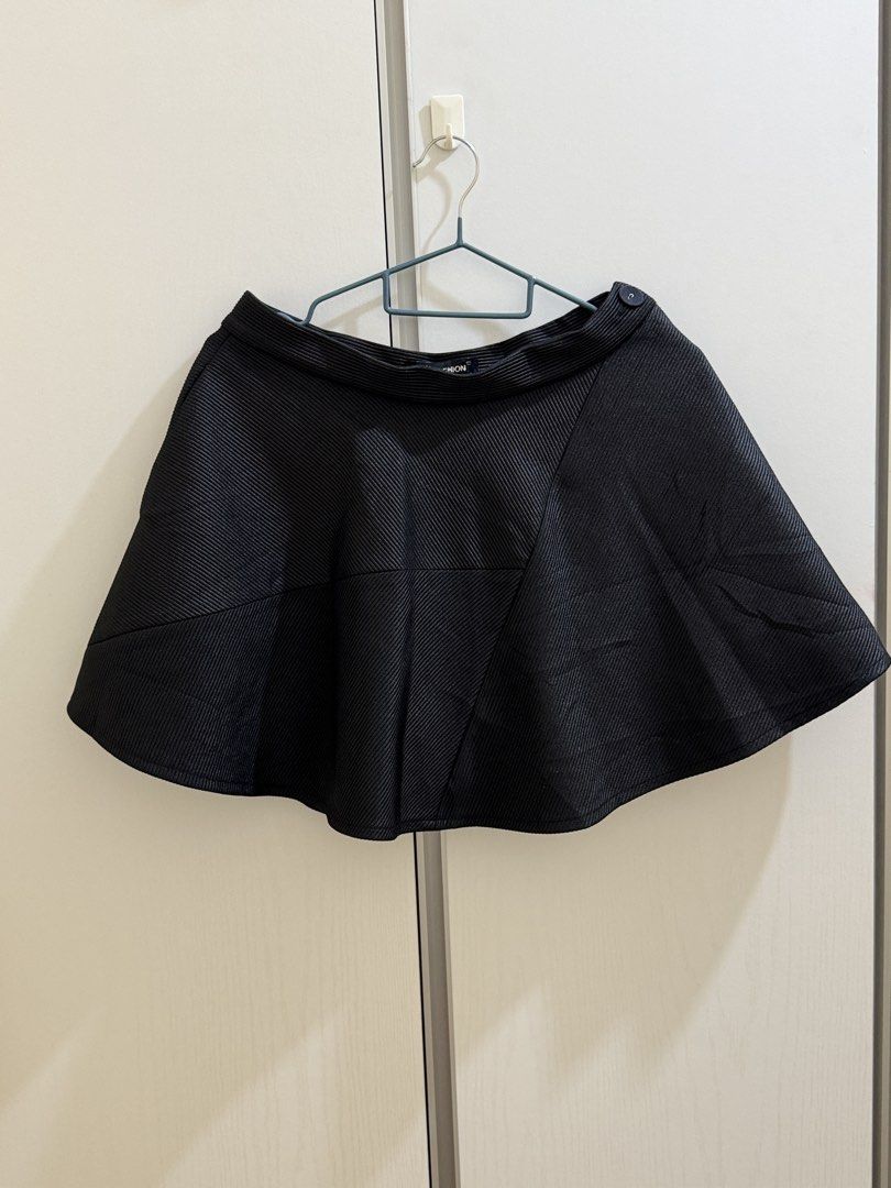 Black Flared Skirt with pocket (Category: Skirts) located in Manila. Submitted by happy_random_finds (Listing ID 1470447311, Image 1). Description: - Brand: L.P Fashion - Waist Line: 30” - Size: Medium (M) - Color: Classic Black - Fabric: Structured ribbed material with a stylish paneled design - Fit: Skater silhouette that flares out nicely - Closure: Side zipper with a cute button detail at the waistband - Extra: Built-in shorts underneath for 