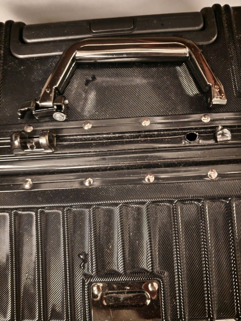 Black Hardside Luggage Suitcase (Category: Luggage) located in Makati City. Submitted by wildwolf.00487d (Listing ID 1470515520, Image 2). Description: - Condition: Top handle accidentally broke off, but side handle, spinner wheels, frame locks & interior are 100% like new! - Very solid aluminum frame lock, super smooth wheels..