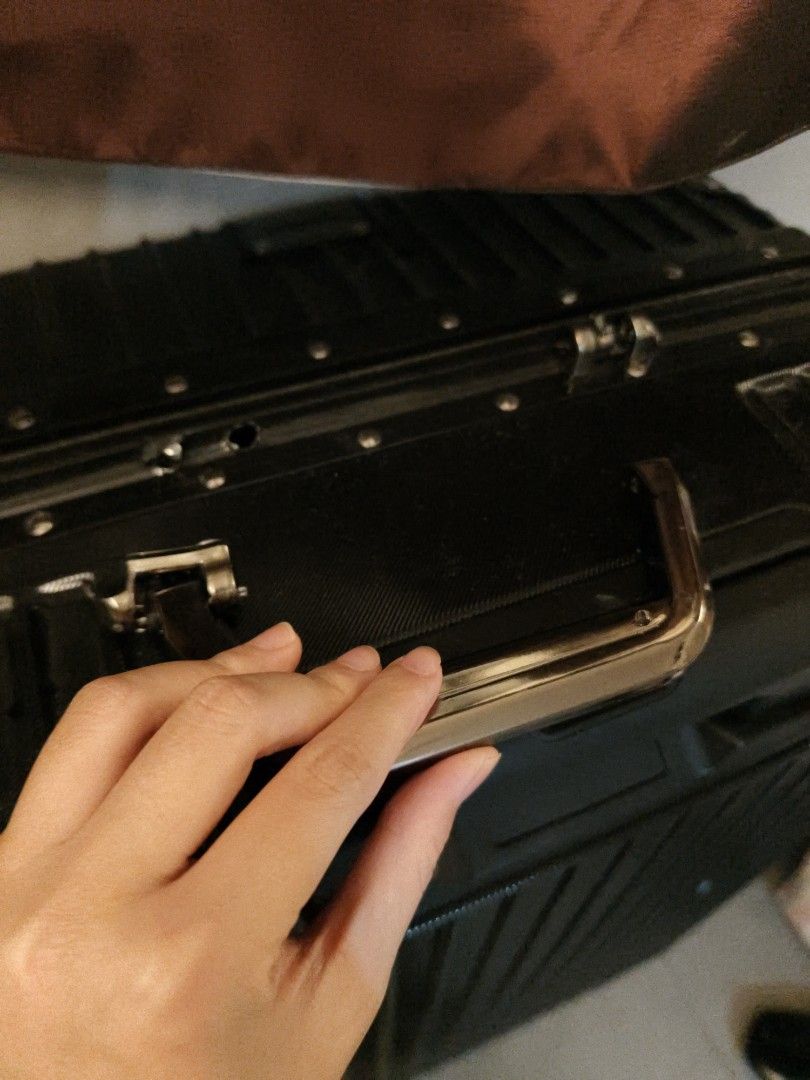 Black Hardside Luggage Suitcase (Category: Luggage) located in Makati City. Submitted by wildwolf.00487d (Listing ID 1470515520, Image 3). Description: - Condition: Top handle accidentally broke off, but side handle, spinner wheels, frame locks & interior are 100% like new! - Very solid aluminum frame lock, super smooth wheels..