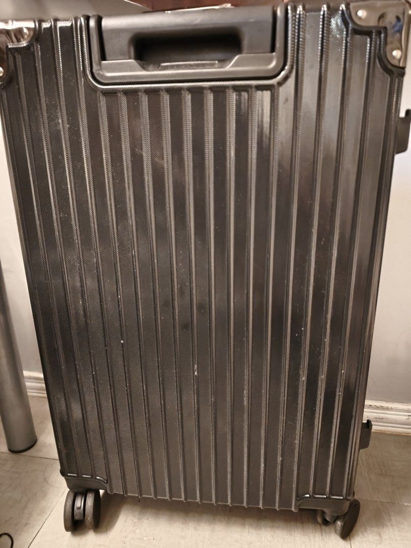 Black Hardside Luggage Suitcase (Category: Luggage) located in Makati City. Submitted by wildwolf.00487d (Listing ID 1470515520, Image 1). Description: - Condition: Top handle accidentally broke off, but side handle, spinner wheels, frame locks & interior are 100% like new! - Very solid aluminum frame lock, super smooth wheels..