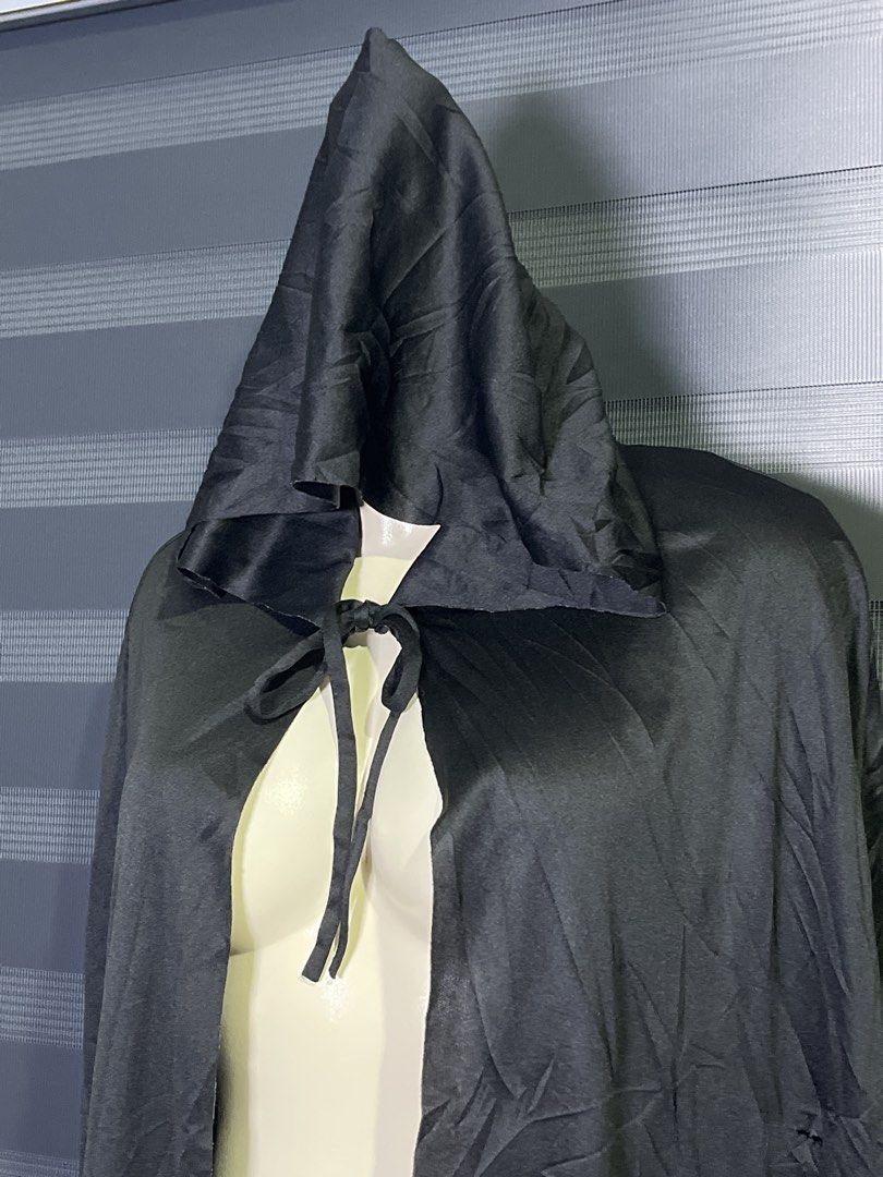 Black Hooded Cape Costume Cloak (Category: Coats, Jackets and Outerwear) located in Caloocan City. Submitted by unicakczxc (Listing ID 1470453403, Image 2). Description: One size fits all 199 ONLY - Color: Black - Material: Lightweight satin-like fabric with natural wrinkles - Closure: Fabric ties at the front neck - Fit: Long length, covers from head to floor on most adults - Versatile: Great for Halloween costumes, cosplay, and quick outfit ove