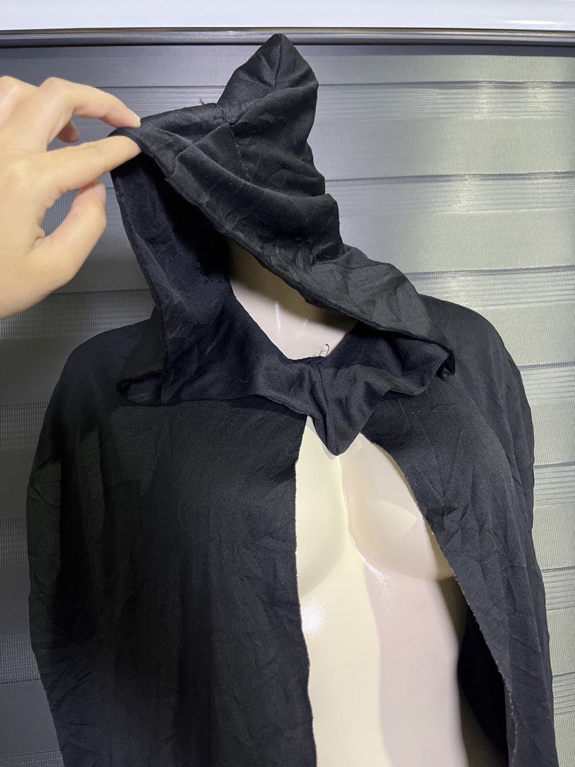 Black Hooded Cloak Cape Costume (Category: Coats, Jackets and Outerwear) located in Caloocan City. Submitted by unicakczxc (Listing ID 1470462492, Image 2). Description: Black Hooded Cloak Cape Costume One size fits all 199 only - Color: Classic Black - Style: Full-length, open front with a structured hood - Material: Lightweight and comfortable - Perfect for: Halloween costumes, cosplay events, and theatrical productions - Easy to layer over any