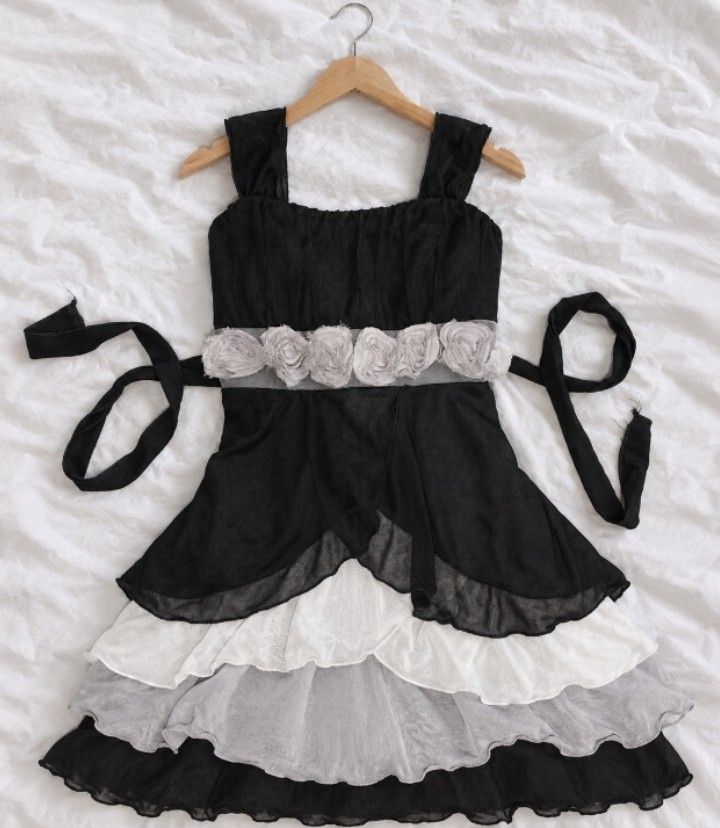 Black layered Ruffle Dress💓🪽 (Category: Others Tops) located in Batangas. Submitted by itgirl.archive (Listing ID 1470499509, Image 1). Description: Speechless Black Layered Ruffle Dress (dress over jeans) 💓🪽 Brand: Speechless💓🪽 Size: 10 (on tag) can fit small to medium Color: Black, White & Gray Details: Wide straps, floral waist detailing, layered ruffle hem Style: Y2K, Fairy Grunge, Vintage Styling: Perfect for wearing over jeans for tha