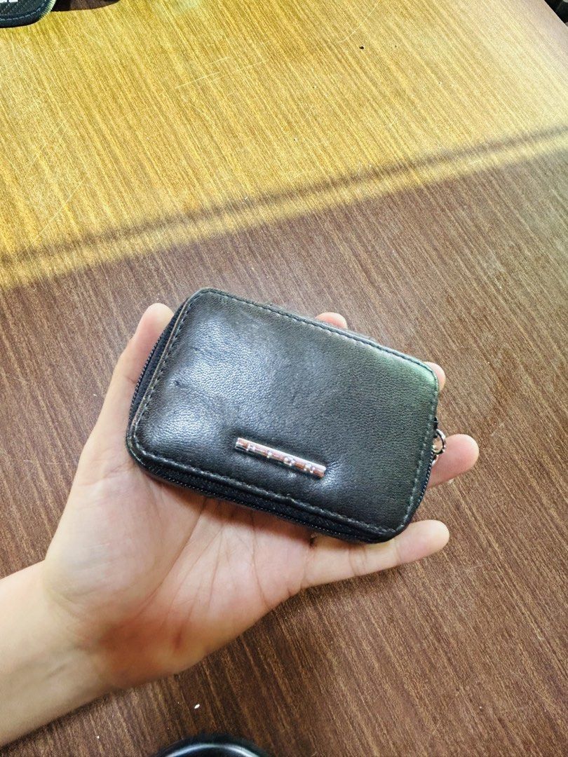 Black Leatherette Zip Pouch With Mirror (Category: Purses & Pouches) located in Manila. Submitted by starbalesukandjapansurplus (Listing ID 1470555507, Image 1). Description: - Color: Classic Black - Closure: Secure zip closure with a stylish front metal accent - Features: Built-in mirror on the upper inner lid - Interior: Clean, black fabric-lined compartment - Size: Compact and handy, fits easily in your bag or hand - Condition: Excellent / Rea