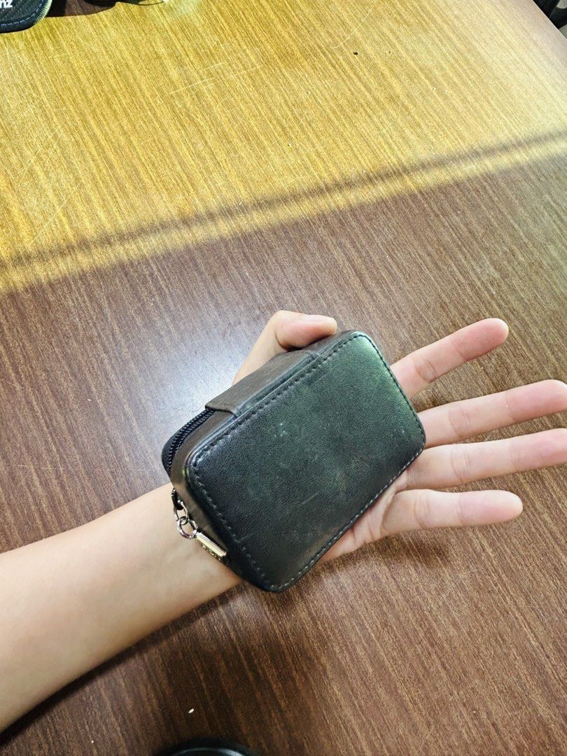 Black Leatherette Zip Pouch With Mirror (Category: Purses & Pouches) located in Manila. Submitted by starbalesukandjapansurplus (Listing ID 1470555507, Image 3). Description: - Color: Classic Black - Closure: Secure zip closure with a stylish front metal accent - Features: Built-in mirror on the upper inner lid - Interior: Clean, black fabric-lined compartment - Size: Compact and handy, fits easily in your bag or hand - Condition: Excellent / Rea