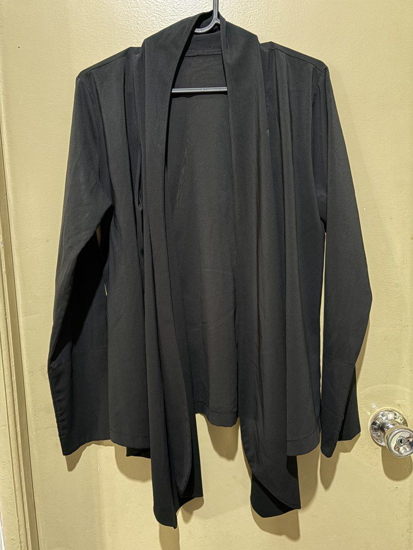 Black Long Sleeve Draped Open Front Cardigan / Coat (Category: Coats, Jackets and Outerwear) located in San Pedro. Submitted by iarruh (Listing ID 1470403092, Image 1). Description: - Color: Solid black - Style: Open front with stylish draped lapels - Material: Lightweight and comfortable fabric - Sleeves: Long with wide cuffs - Details: Clean stitching throughout - Perfect for effortless everyday layering over shirts or dresses.