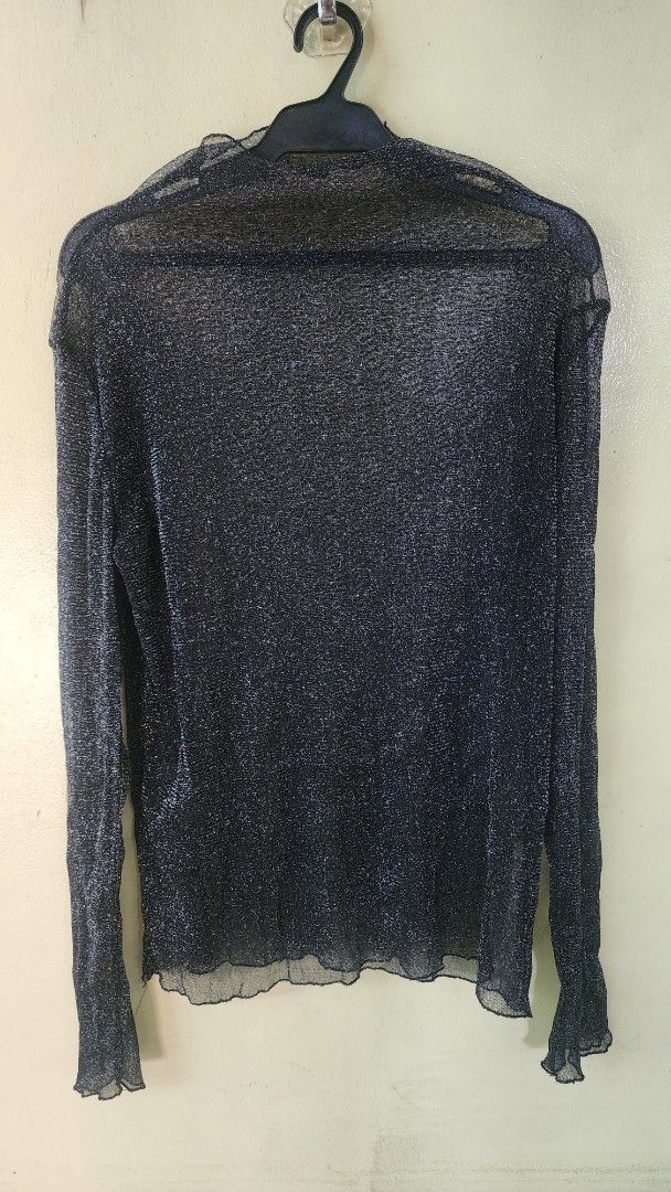 Black metallic mesh long sleeve sheer top (Category: Longsleeves) located in Quezon City. Submitted by amenohana (Listing ID 1470356717, Image 2). Description: - Color & Style: Black long sleeve top with metallic silver threading - Fabric: Sheer, lightweight, and stretchy mesh material - Details: Trendy lettuce hem on cuffs and bottom edge, classic scoop neckline - Fit: Comfortable and figure-flattering stretch - Versatility: Excellent layering p