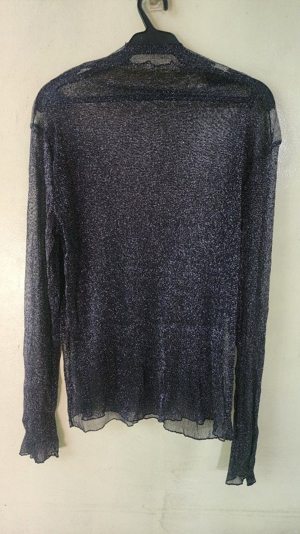 Black metallic mesh long sleeve sheer top (Category: Longsleeves) located in Quezon City. Submitted by amenohana (Listing ID 1470356717, Image 1). Description: - Color & Style: Black long sleeve top with metallic silver threading - Fabric: Sheer, lightweight, and stretchy mesh material - Details: Trendy lettuce hem on cuffs and bottom edge, classic scoop neckline - Fit: Comfortable and figure-flattering stretch - Versatility: Excellent layering p