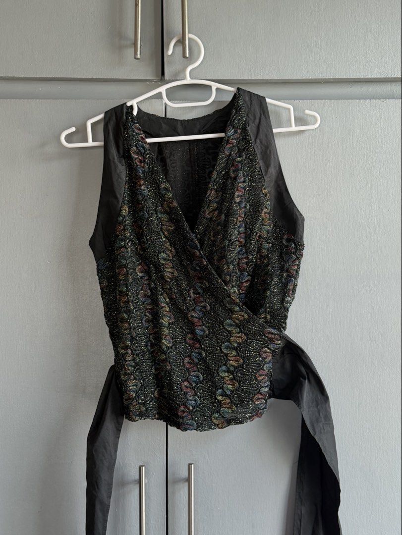 Black Metallic/Lace Sleeveless Wrap Top (Category: Sleeveless) located in San Juan City. Submitted by itemsfromkam (Listing ID 1470452879, Image 1). Description: •fits S-L • v-neck wrap top, shimmery/metallic, a bit sheer •unique, lightweight, thrifted in bangkok .