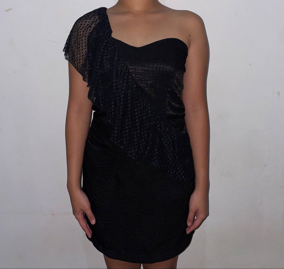 Black One-Shoulder Ruffle Mini Dress (Category: Dresses) located in Iligan City. Submitted by lisiantbel (Listing ID 1470529848, Image 2). Description: - Color: black - Style: One-shoulder bodycon mini dress - Material: Textured snake-pattern fabric with sheer dotted mesh - Details: Asymmetrical diagonal ruffle overlay - Perfect for: Parties, clubbing, and date nights.