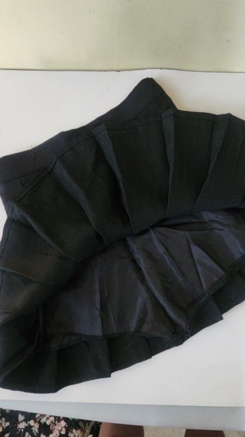 Black Pleated Mini Skirt (Category: Skirts) located in Quezon City. Submitted by amenohana (Listing ID 1470357036, Image 2). Description: - Color: Classic solid black - Design: Neat box pleats all around - Comfort: Fully lined interior fabric - Versatility: Pairs easily with any top - Style: Casual mini skirt, great for everyday rotation.