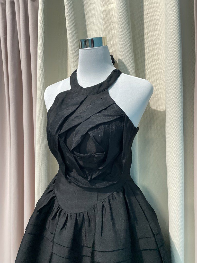 Black Rosette Halter Mini Dress (Category: Dresses) located in Taguig. Submitted by veronicakloset (Listing ID 1470360004, Image 3). Description: Black Rosette Halter Mini Dress 🖤 ✨Price: ₱250 | Like New | S-M Black halter mini dress with 3D fabric rose detail and a flattering flared skirt! Perfect for vintage-inspired outfits, coquette looks, formal parties, or a chic Halloween fit ✨🕯️ 📍 Pembo, Taguig 💌 DM to mine! Fixed price, no haggling. 