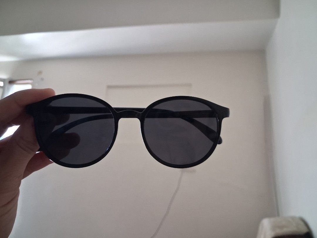 Black Round Frame Sunglasses (Category: Sunglasses & Eyewear) located in Manila. Submitted by kxkcx (Listing ID 1470351678, Image 2). Description: - Style: Classic retro round design - Lenses: Dark tinted for clear visibility outdoors - Frame: Lightweight plastic for all-day comfort - Use: Perfect everyday accessory for sunny days.