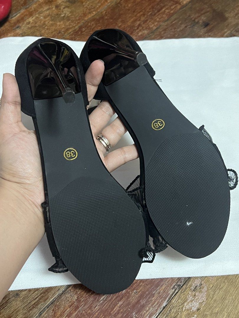 Black Ruffled Strap High Heel Sandals Size 38 (Category: Heels) located in Quezon City. Submitted by justlei (Listing ID 1470364086, Image 3). Description: Brand new with dust bag and box. Never worn. - Comfortable gamitin. Kaso may newborn ako na laging karga kaya hindi pa magamit so sell muna. - Style: Black stiletto high heels with ankle strap and buckle closure - Details: Chic sheer pleated ruffles on the front strap - Size: 38 (marked on sol