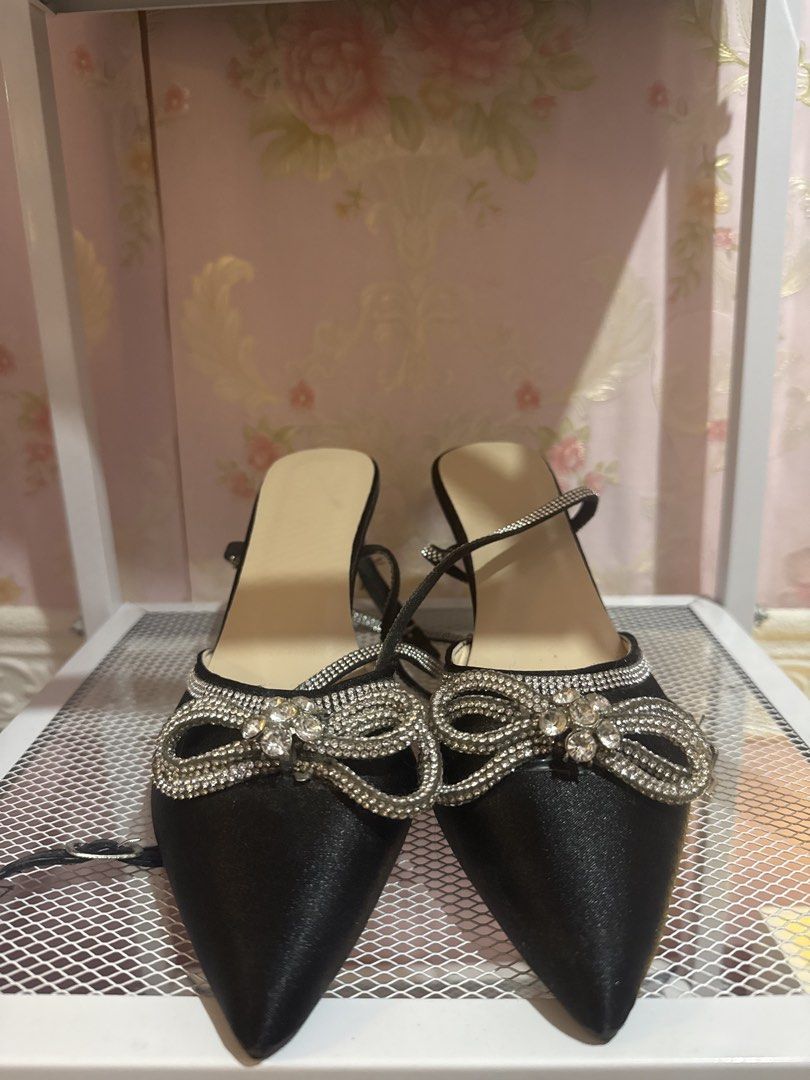 Black satin pointed toe rhinestone bow heels (Category: Heels) located in Bacoor. Submitted by micsr (Listing ID 1470460864, Image 3). Description: FREE FREE FREE Size 36 Freebie for buyer only purchase any sandals/heels . send me this if you want for free Black satin pumps with pointed toes. Rhinestone crystal bow on the front. Thin stiletto heels. Long crystal rhinestone straps to wrap around the ankles. Neutral beige insoles. Size 6 Soles show
