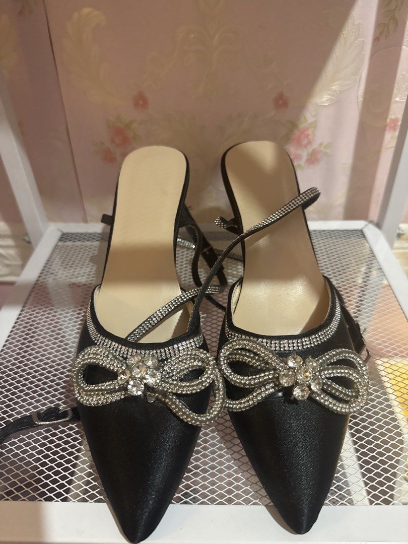 Black satin pointed toe rhinestone bow heels (Category: Heels) located in Bacoor. Submitted by micsr (Listing ID 1470460864, Image 2). Description: FREE FREE FREE Size 36 Freebie for buyer only purchase any sandals/heels . send me this if you want for free Black satin pumps with pointed toes. Rhinestone crystal bow on the front. Thin stiletto heels. Long crystal rhinestone straps to wrap around the ankles. Neutral beige insoles. Size 6 Soles show