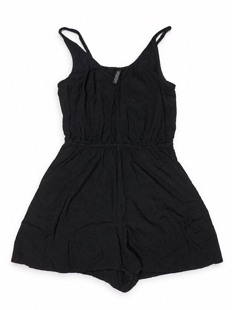 Black sleeveless romper jumpsuit playsuit (Category: Rompers) located in Cabanatuan. Submitted by wantsomethrifts (Listing ID 1470543236, Image 1). Description: - Color: Classic black - Style: Easy slip-on romper - Neckline & Straps: Scoop neck with thin shoulder straps - Waist: Elasticated for a flattering, gathered fit - Fabric: Lightweight and breathable, ideal for warm weather - Versatility: Basic solid color that easily matches any outfit.