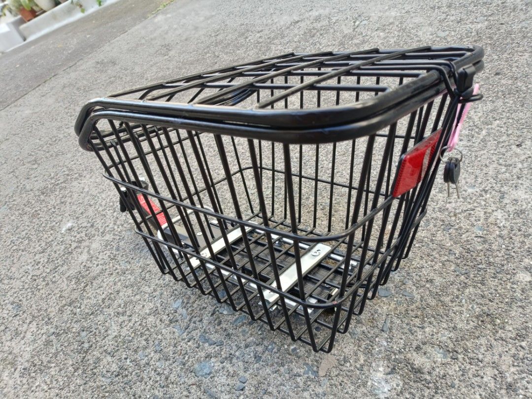 Black Wire Bicycle Basket with Handlebar Mount (Category: Bicycles) located in Quezon City. Submitted by cataleya0723 (Listing ID 1470356506, Image 2). Description: - Sturdy black wire basket for bicycles - Includes metal mounting bracket for handlebars - Heavy-duty metal mesh with reinforced base rails - Open top design for easy loading and unloading - Matte black finish, clean condition with no rust or damage.
