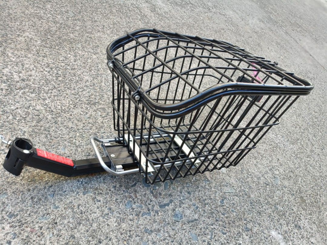 Black Wire Bicycle Basket with Handlebar Mount (Category: Bicycles) located in Quezon City. Submitted by cataleya0723 (Listing ID 1470356506, Image 1). Description: - Sturdy black wire basket for bicycles - Includes metal mounting bracket for handlebars - Heavy-duty metal mesh with reinforced base rails - Open top design for easy loading and unloading - Matte black finish, clean condition with no rust or damage.
