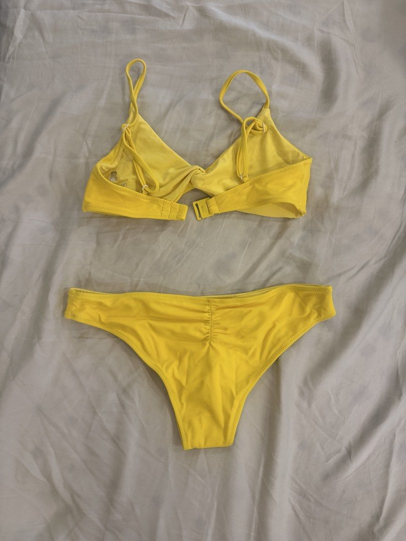 Blackbough Swim yellow bikini set (Category: Bikinis & Swimsuits) located in Quezon City. Submitted by monmonmon13 (Listing ID 1470400646, Image 2). Description: Blackbough Swim yellow bikini set 🔆 - size SMALL top, MEDIUM bottoms - never used, hygienic liner still intact - top is in style: Tona bikini top - bottoms style: forgot na but looks like Moderate (with ruched back detail) - slightly negotiable, can be sold separately.