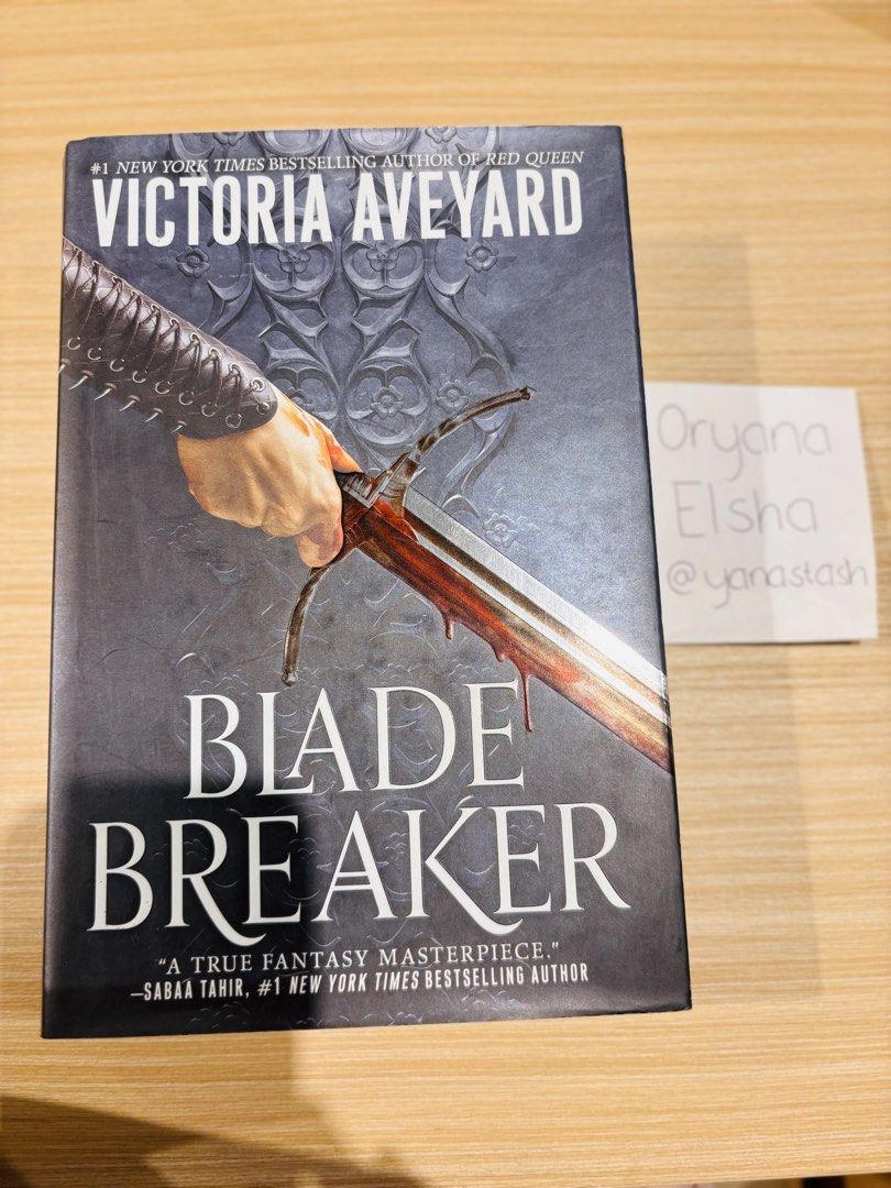 Blade Breaker by Victoria Aveyard (Category: Storybooks) located in Manila. Submitted by yanastash (Listing ID 1470515085, Image 2). Description: - Title: Blade Breaker by Victoria Aveyard - Genre: Fantasy Fiction - Format: Hardcover with black dust jacket - Condition: Read once, clean pages, well-maintained spine and covers - Storage: Properly stored on a shelf, great for collection.