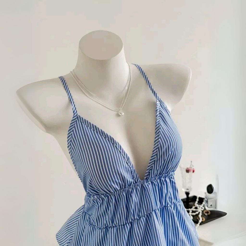 Blue and white striped cami halter top (Category: Sleeveless) located in Quezon City. Submitted by vam681 (Listing ID 1470528537, Image 1). Description: - Design: Blue and white vertical stripes with a halter neck and crossover front straps - Neckline: Flattering V-neckline - Fit: Smocked elastic bust panel with a cute flared peplum hem - Material: Lightweight and breathable fabric - Perfect for:casual dates, vacations, or beach days - used once 