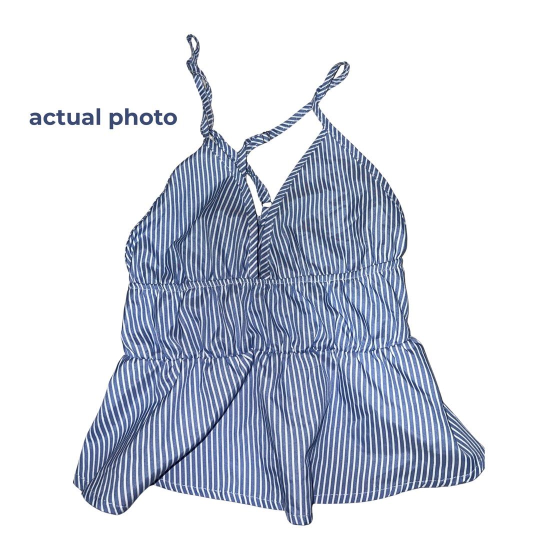 Blue and white striped cami halter top (Category: Sleeveless) located in Quezon City. Submitted by vam681 (Listing ID 1470528537, Image 2). Description: - Design: Blue and white vertical stripes with a halter neck and crossover front straps - Neckline: Flattering V-neckline - Fit: Smocked elastic bust panel with a cute flared peplum hem - Material: Lightweight and breathable fabric - Perfect for:casual dates, vacations, or beach days - used once 