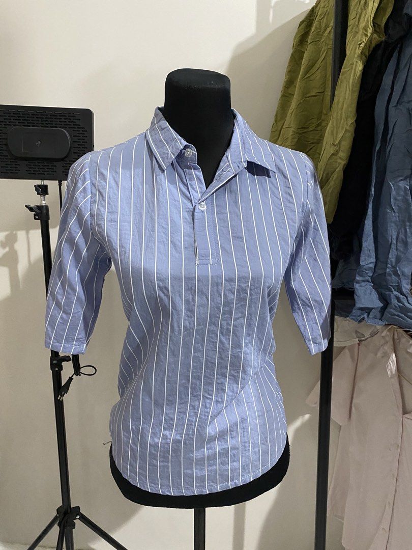 Blue and White Striped Half Sleeve Collared Blouse (Category: Blouses) located in Manila. Submitted by mpt99876 (Listing ID 1470496510, Image 1). Description: - Color & Pattern: Blue with vertical white stripes - Style: Collared blouse with half-length sleeves and chest button placket - Versatility: Perfect for office wear or casual outings - Pairing: Easily matches with skirts or trousers - Condition: Brand new / Excellent quality.