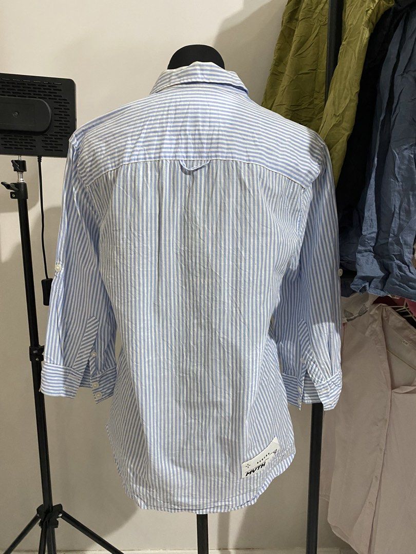 Blue and White Striped Half Sleeve Collared Blouse (Category: Blouses) located in Manila. Submitted by mpt99876 (Listing ID 1470496510, Image 3). Description: - Color & Pattern: Blue with vertical white stripes - Style: Collared blouse with half-length sleeves and chest button placket - Versatility: Perfect for office wear or casual outings - Pairing: Easily matches with skirts or trousers - Condition: Brand new / Excellent quality.