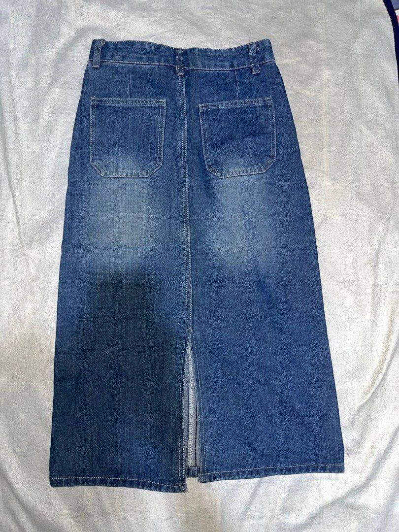 Blue denim midi skirt with back slit (Category: Skirts) located in Legazpi City. Submitted by chynnunez (Listing ID 1470427975, Image 2). Description: - Style: Medium wash denim midi skirt with a classic straight cut - Closure: Front button and zipper - Pockets: Two functional front pockets and two back patch pockets - Comfort: Back center slit for easy movement - Versatility: Perfect staple piece for effortless everyday outfits.