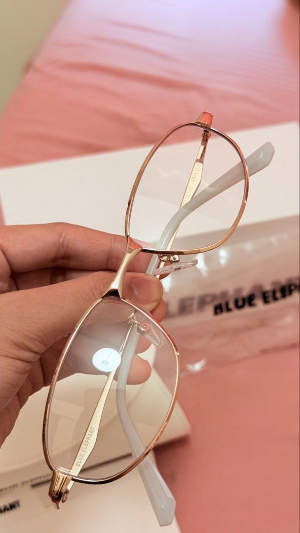 Blue Elephant 03808 Nova Gold Eyeglasses with Case (Category: Sunglasses & Eyewear) located in Manila. Submitted by butter.g13 (Listing ID 1470556870, Image 1). Description: - Brand: Blue Elephant - Model: Nova - Color: Gold (metal wire design) - Lenses: Clear (unworn condition) - Inclusions: Original white hard case, branded box, plastic dust bag, and certification cards from the Seongsu flagship store dated 2025 - Condition: 100% brand new and 