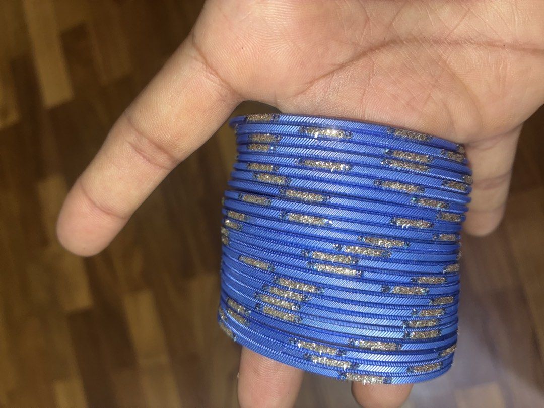 Blue glitter bangles stack set (Category: Bracelets) located in Singapore. Submitted by buycarous (Listing ID 1470369023, Image 2). Description: - Vibrant bright blue color with eye-catching glitter accents - Features unique textured line designs - Versatile stackable set (includes all pieces shown in photos) - Perfect accessory for traditional outfits, parties, or everyday styling - Scale and size clearly shown in listing photos.