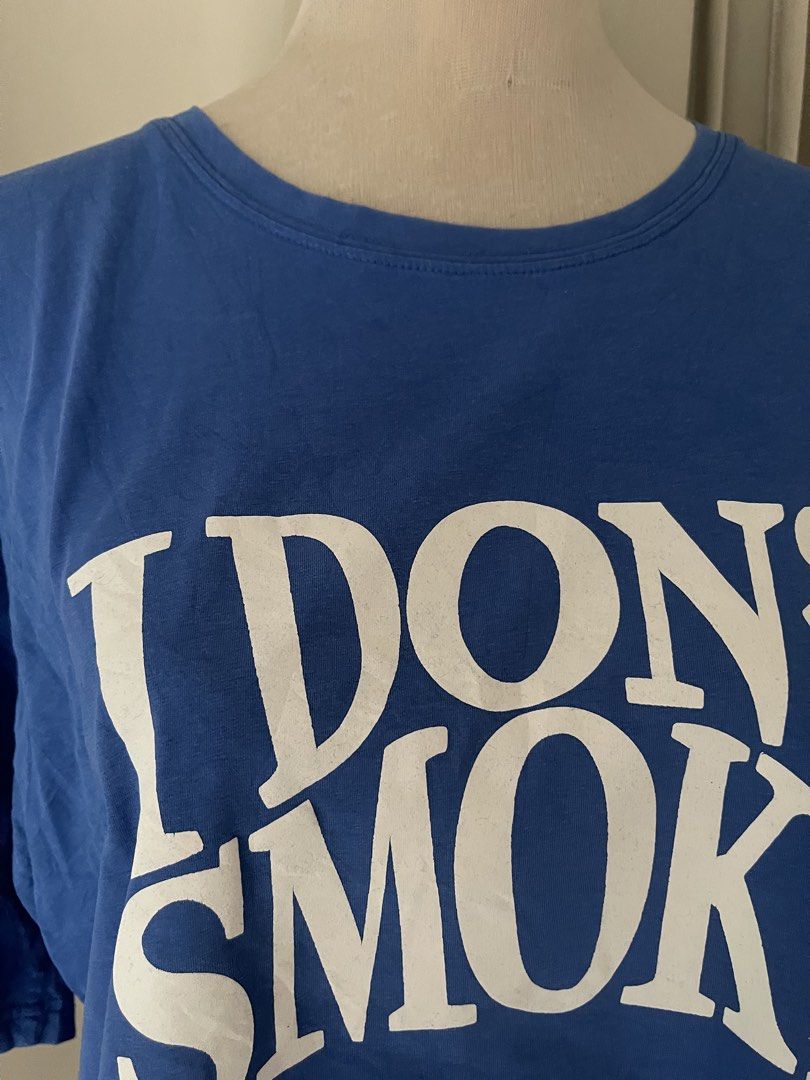 Blue KTEE (Category: Tshirts & Polo Shirts ) located in Cainta. Submitted by zlove111 (Listing ID 1470456067, Image 3). Description: - Color: Bright blue with large white 'I Don't Smoke' text on the chest - Fit: Relaxed, oversized fit for daily casual wear - Material: Soft and comfortable cotton - Details: Classic crew neckline and short sleeves up to xl 22" .