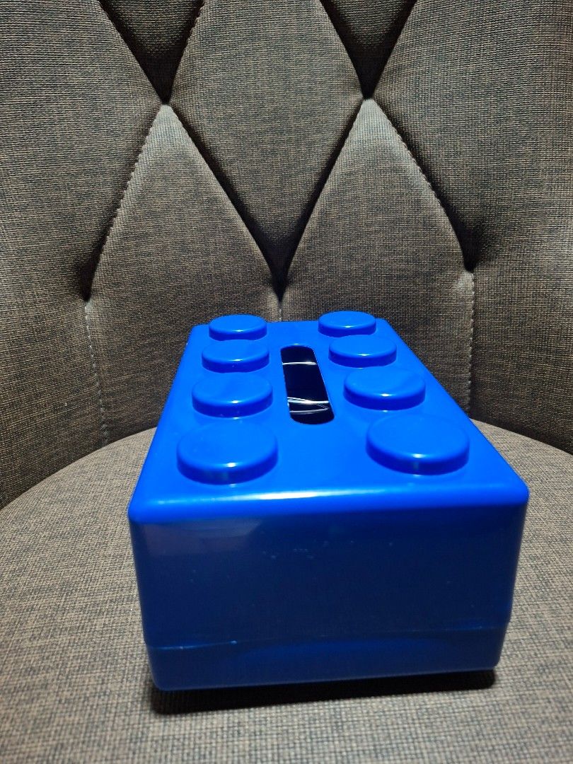 Blue LEGO Brick Tissue Box Holder (Category: Lego & Building Sets) located in Makati City. Submitted by paudeclutters (Listing ID 1470428656, Image 2). Description: - Fun blue tissue box shaped like a giant Lego brick - Features classic stud bumps and a top slot for easy tissue pulling - Made of durable, easy-to-wipe-clean plastic - Fits standard tissue packs inside - Perfect quirky decor for a kid's room, playroom, or office des.