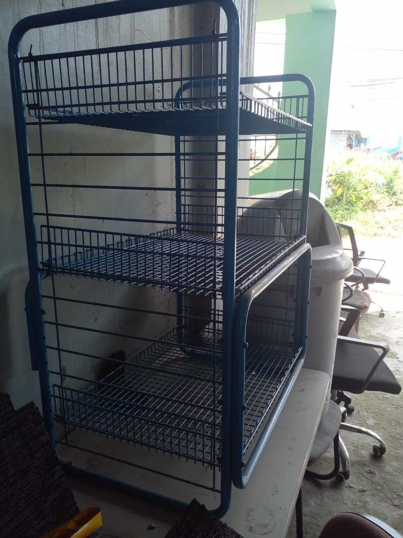 Blue metal 3-tier wire basket storage rack (Category: Storage Boxes & Baskets) located in Manila. Submitted by wisegem-231b (Listing ID 1470404701, Image 2). Description: - Color: Blue - 3 tiers of open wire mesh baskets - Sturdy frame construction for heavy-duty storage - Versatile use: ideal for kitchen supplies, pantry items, or office clutter - Can stand upright on a tabletop or floor - Clean look and ready to use.