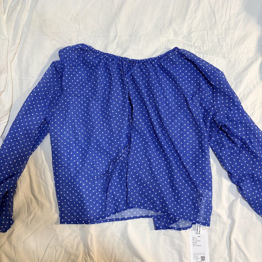 Blue Polka Dot Long Sleeve Blouse (Category: Longsleeves) located in Manila. Submitted by yiiio3o (Listing ID 1470509004, Image 1). Description: - Brand: Taobao - Size: XL - RFS: See through (need to wear top inside) - Color/Pattern: Bright blue with white polka dots - Material: Lightweight chiffon - Details: Scoop neckline with front tie string, relaxed fit - Condition: Brand new with tag attached - Versatile styling: Easy to pair with jeans or 