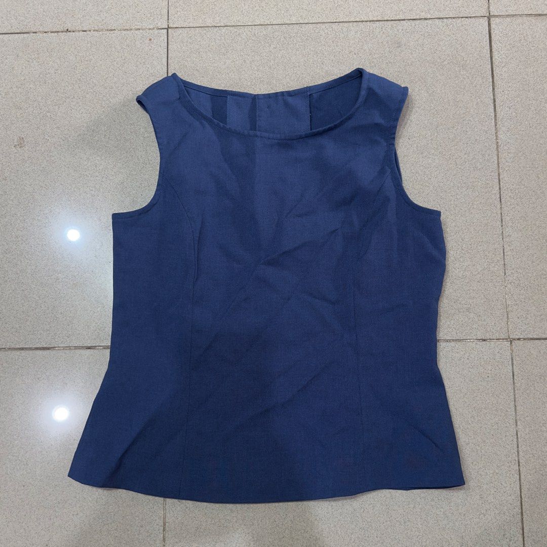 Blue sleeveless button-back tank top blouse (Category: Sleeveless) located in Quezon City. Submitted by outyougoph (Listing ID 1470362072, Image 1). Description: 1 missing button.