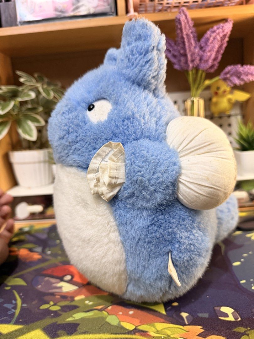 Blue Totoro Studio Ghibli Plush Soft Toy (Category: Plushies & Soft Toys) located in Baguio. Submitted by jonathanseller_buyer (Listing ID 1470514732, Image 2). Description: - Official Studio Ghibli Blue Totoro plush toy - Soft and fluffy bright blue and white fur - Comes with a white pouch accessory and Japanese text on the back - Made in Indonesia (tag intact) - Excellent, clean condition (no rips or stains).