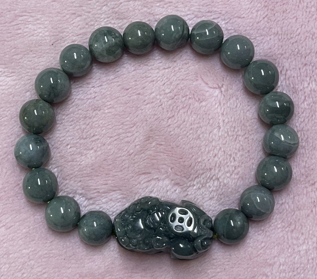 Blue Water Jadeite with Pixiu Charm (Category: Bracelets) located in Manila. Submitted by Crystal_Oracle (Listing ID 1470423695, Image 2). Description: Blue water jadeite is a rare, highly valued Guatemala variety prized for its tranquil, light blue-to-greenish, lake-like appearance and superior translucency. It acts as a powerful, calming talisman, enhancing emotional balance, reducing stress, promoting clear communication, and offering spiritua