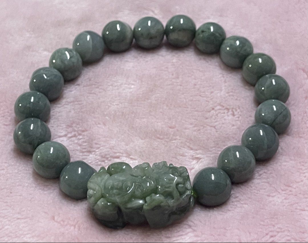 Blue Water Jadeite with Pixiu Charm (Category: Bracelets) located in Manila. Submitted by Crystal_Oracle (Listing ID 1470423695, Image 3). Description: Blue water jadeite is a rare, highly valued Guatemala variety prized for its tranquil, light blue-to-greenish, lake-like appearance and superior translucency. It acts as a powerful, calming talisman, enhancing emotional balance, reducing stress, promoting clear communication, and offering spiritua