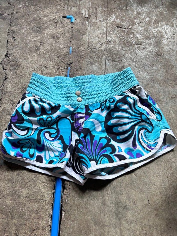 swim shorts (Category: Shorts) located in Manila. Submitted by lovely.453 (Listing ID 1470383642, Image 1). Description: - Floral pattern in turquoise blue, black, and purple size 24-28 - Wide smocked waistband with two front metal buttons - Stylish white trim along hems and sides - Lightweight fabric and short length for ultimate comfort.