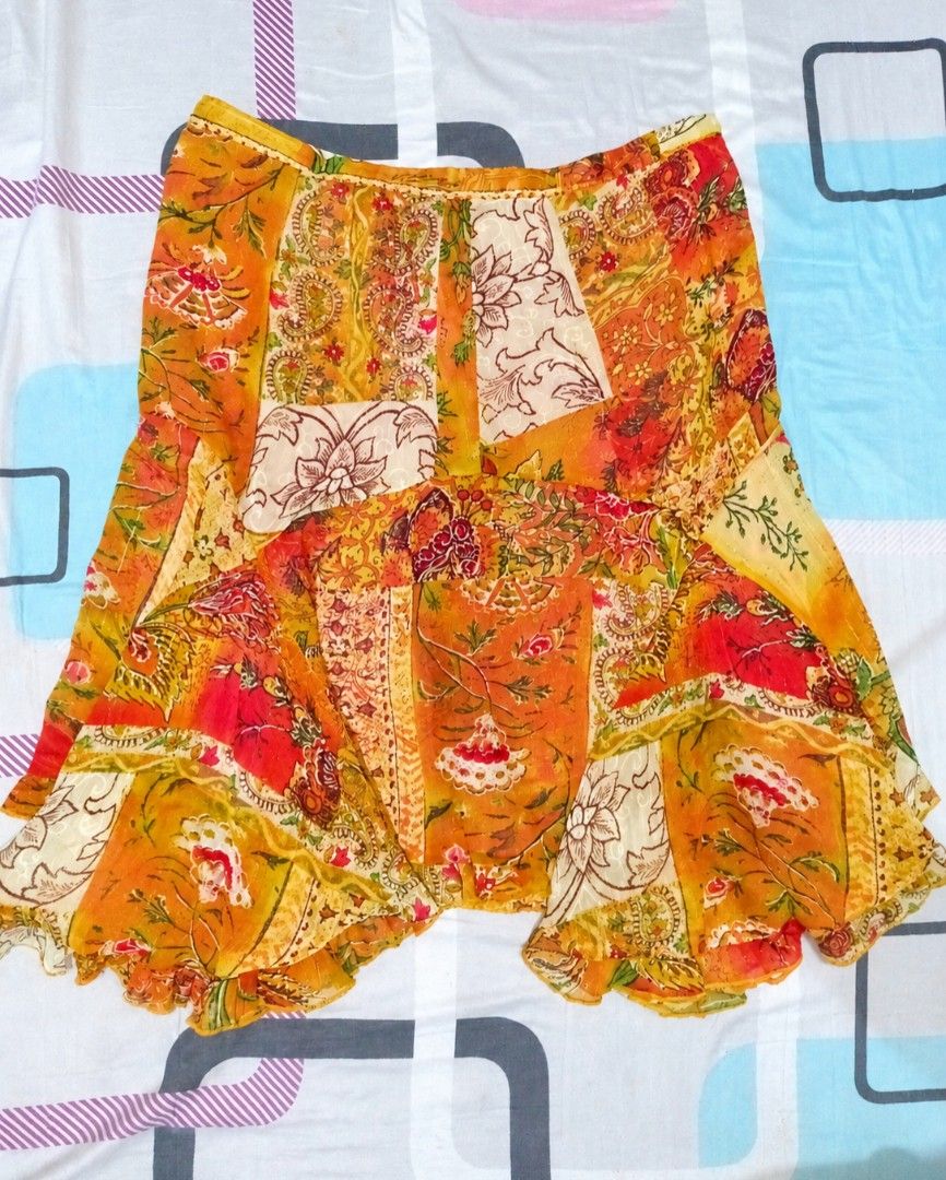 Boho Patchwork Floral Print Ruffle Skirt (Category: Skirts) located in Iloilo. Submitted by xya.xoxo28 (Listing ID 1470539201, Image 1). Description: - Style: Orange patchwork tiered skirt with mixed floral and paisley prints - Design: Flowy silhouette with a cute ruffled hem and convenient pull-on style - Material: Lightweight and breathable fabric - Perfect for: Sunny days, beach trips, or casual day-outs.