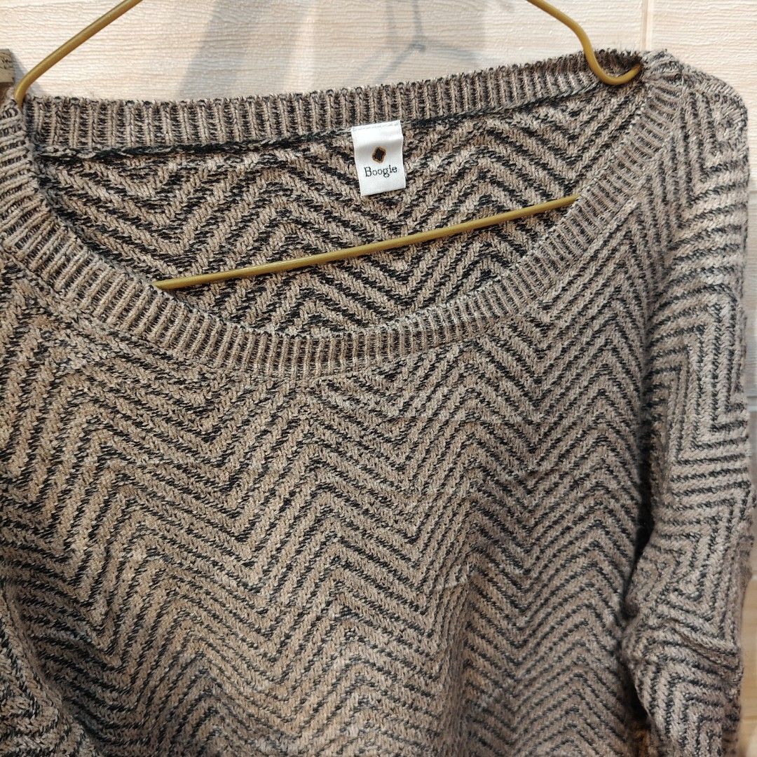 Boogie Brown Herringbone Layered Light Knit Sweater Freesize (Category: Longsleeves) located in Bulacan. Submitted by alyssarys (Listing ID 1470522308, Image 3). Description: - Brand: Boogie - Design: Brown knit sweater with a chic chevron pattern and built-in white pleated hem - Material: Lightweight, stretchable, and comfy fabric - Fit: Fits Medium to Extra Large (oversized look for smaller frames) - Details: Long sleeves and classic round neck