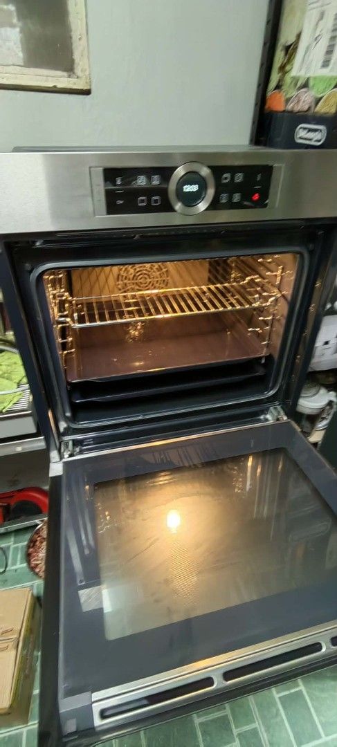 Bosch Built-In Oven with Digital Control Panel (Category: Ovens & Toasters) located in Taguig. Submitted by gongolly2007 (Listing ID 1470497491, Image 3). Description: - Brand: Bosch built-in electric oven (Stainless Steel) - Condition: Fully functional, ready for installation display - Cosmetic Flaws: Noticeable rust and wear along the bottom handle area and body - Features: Digital control panel with rotating dial and touch buttons, 4D hot air 