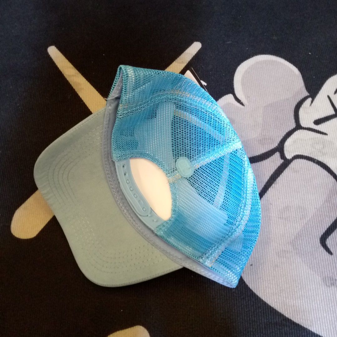 BOSS Blue Trucker Hat Cap (Category: Caps & Hats) located in Manila. Submitted by pablopresk0. (Listing ID 1470508014, Image 2). Description: - Brand: BOSS - Color: Light blue with vibrant blue mesh back - Design: Structured front crown with BOSS logo and three colored accent blocks - Fit: Adjustable plastic snapback closure - Details: Interior brim and lining feature signature BOSS branding - Condition: Clean shape, breathable mesh panels for ai