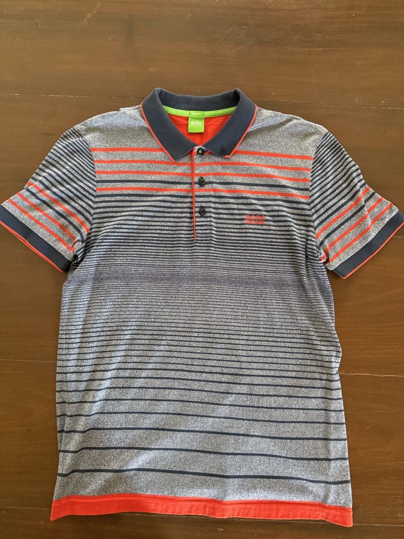 Hugo Boss Polo Shirt (Category: Tshirts & Polo Shirts ) located in Angeles City. Submitted by gillian_a (Listing ID 1470419247, Image 1). Description: Color: Grey with orange stripes Size: L (Modern Fit) No defects Check photos for dimensions/measurements.