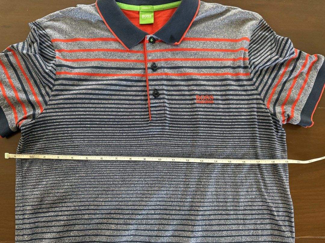 Hugo Boss Polo Shirt (Category: Tshirts & Polo Shirts ) located in Angeles City. Submitted by gillian_a (Listing ID 1470419247, Image 3). Description: Color: Grey with orange stripes Size: L (Modern Fit) No defects Check photos for dimensions/measurements.