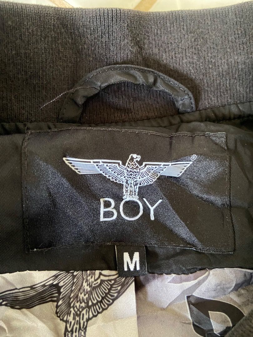 Boy London Embroidered Jacket (Category: Coats, Jackets and Outerwear) located in Caloocan City. Submitted by koolkids1994 (Listing ID 1470516266, Image 2). Description: Selling an authentic, pre-loved Boy London Bomber Jacket in excellent condition. • Color: Sleek Black with Gold accents • Size: Medium (M / 175/92A) • Model Code: B211NN103802 D12 • Material: 100% Nylon Shell / 100% Polyester Lining • Design Features: • Gold embroidered "BOY" log